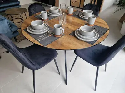 a wooden table with chairs and cups and plates on it at Phoenix in Ghent