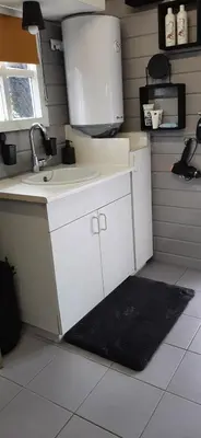 a kitchen with a sink and a counter at Kamer 22 Bed & Breakfast in Poppel
